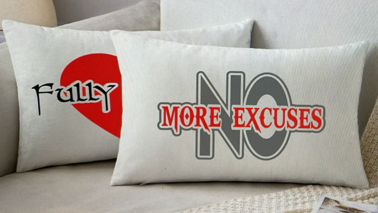 Two pillows with motivational phrases on a couch